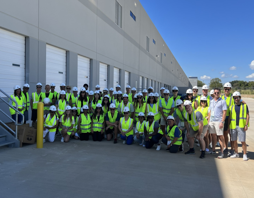 Granite team poses outside a warehouse.